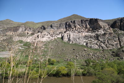 Scenic view of rocky mountains against clear sky