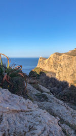 Scenic view of sea against clear blue sky