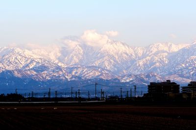 Scenic view of snowcapped mountains against sky
