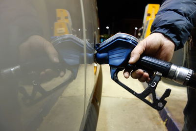 Midsection of man repairing car