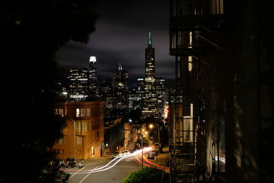 Illuminated city buildings at night