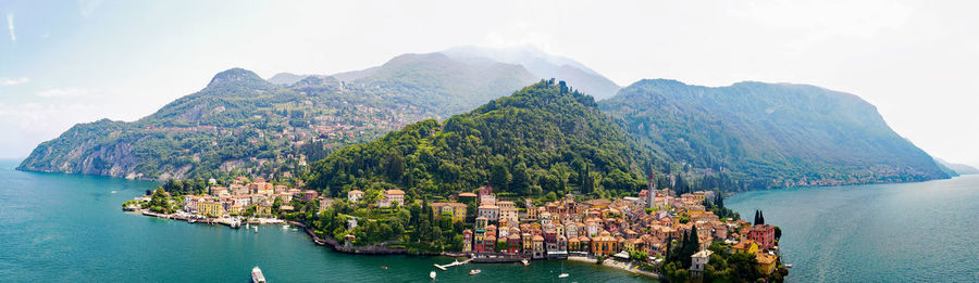 Panoramic view of sea and mountains against sky