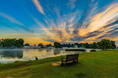 Scenic view of lake against sky during sunset