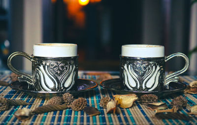 Close-up of coffee cup on table