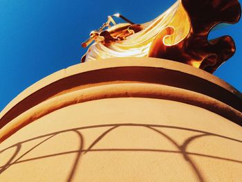 Low angle view of built structure against blue sky