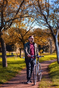 Man riding bicycle in park