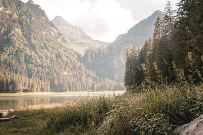 Scenic view of lake and mountains against sky