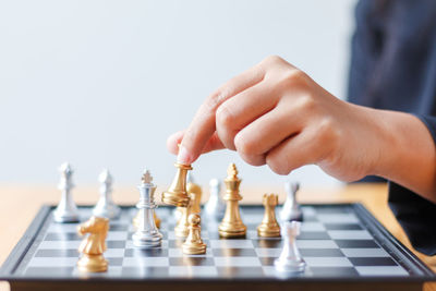 Close-up of child playing on table