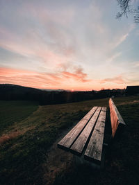 Scenic view of field against sky during sunset