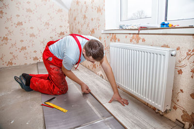 Carpenter working in incomplete home