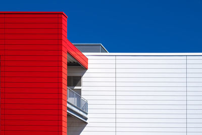 Low angle view of building against clear blue sky