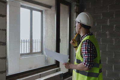 Side view of engineer working at construction site