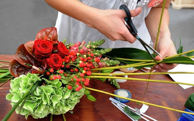 Close-up of woman making bouquet