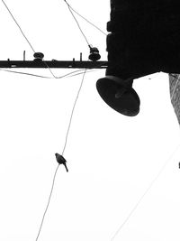 Low angle view of man on boat against clear sky