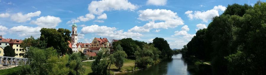 Buildings against cloudy sky