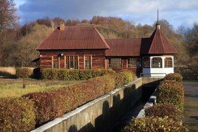 Gazebo by trees against sky