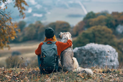 Rear view of dog on field