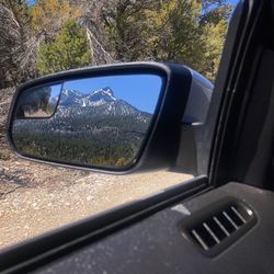 Reflection of car on side-view mirror