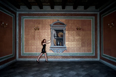 Woman in front of door