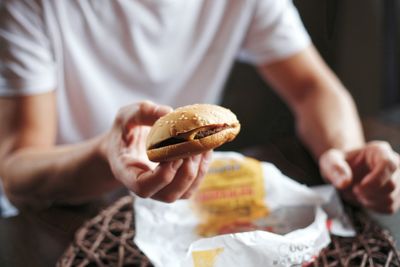Midsection of man holding ice cream