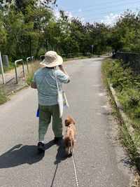 Dog walk with old lady mama