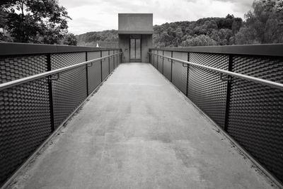 Footbridge against sky