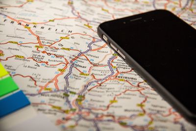 Close-up of smart phone on map