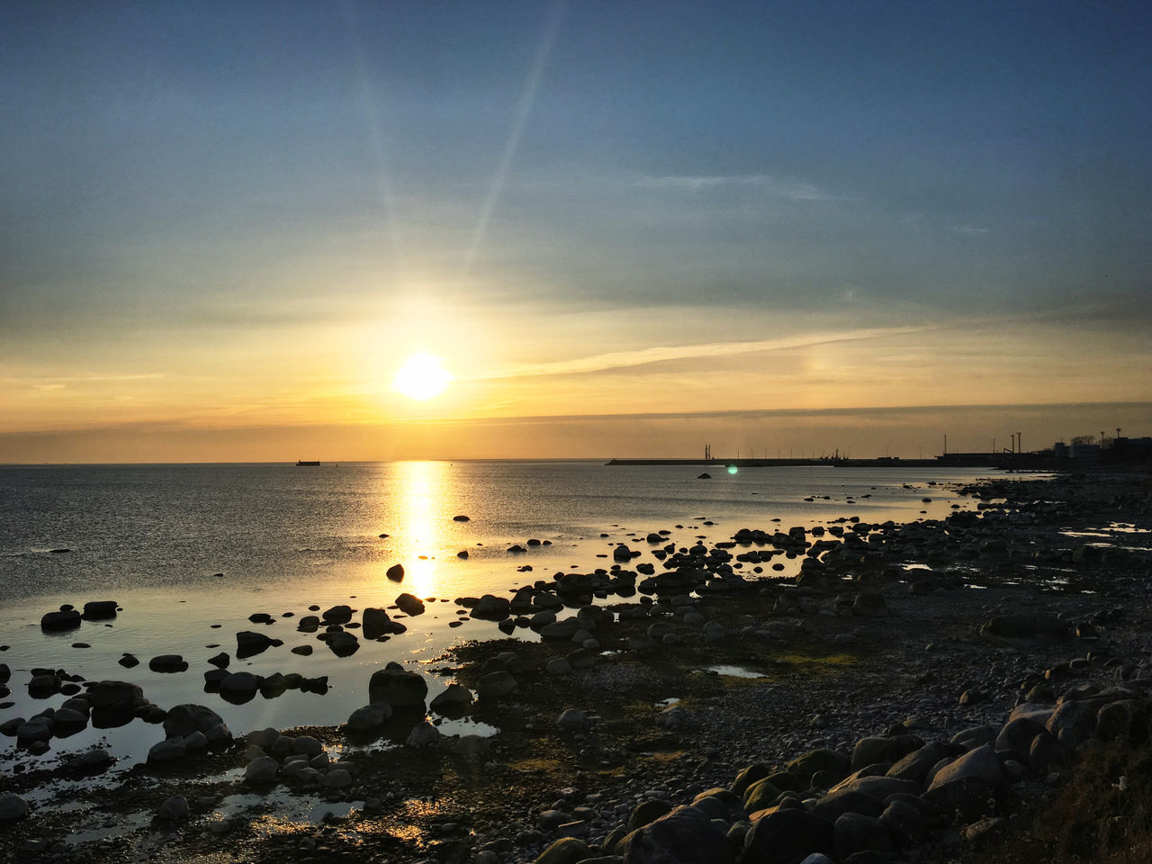 sky, sea, water, beach, horizon, sunset, beauty in nature, land, scenics - nature, horizon over water, nature, ocean, tranquility, wave, dawn, sunlight, tranquil scene, sun, shore, body of water, coast, rock, evening, idyllic, cloud, wind wave, no people, seascape, outdoors, sand, reflection, coastline, environment, travel destinations, afterglow, non-urban scene, travel, motion, orange color