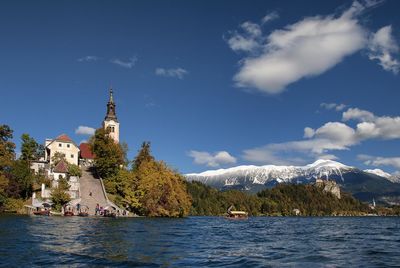 Panoramic view of buildings and mountains against sky