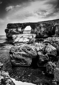 Scenic view of sea against cloudy sky