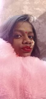 Portrait of woman with pink face