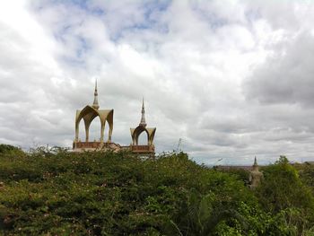 Traditional windmill against sky