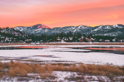 Scenic view of snowcapped mountains against sky during sunset