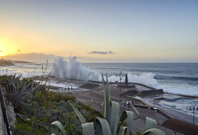 Panoramic shot of sea against sky during sunset