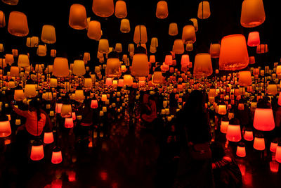 Illuminated lanterns hanging at night