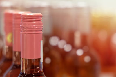 Close-up of rosé wine bottles in store