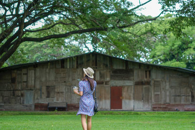 Full length of woman standing on field