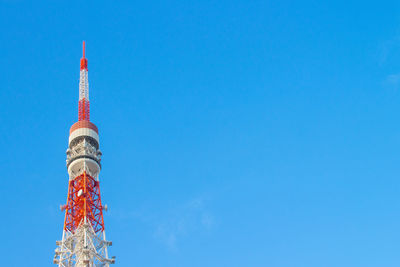 Low angle view of communications tower against sky