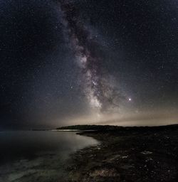 Scenic view of sea against sky at night