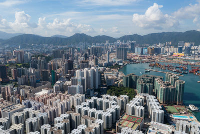 High angle view of buildings in city against sky