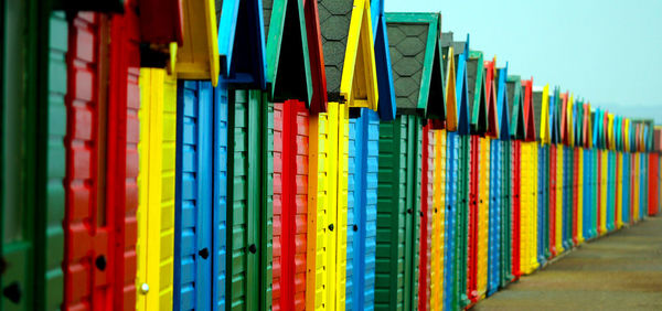 Colorful beach huts in row