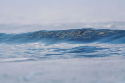 Scenic view of sea against sky during winter