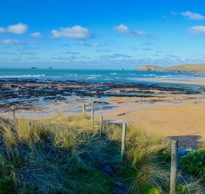 Scenic view of sea against blue sky