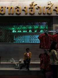 Woman sitting in store