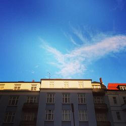 Low angle view of building against blue sky