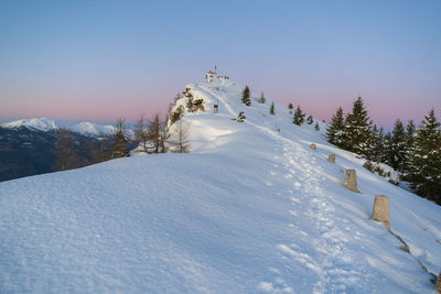 Scenic view of snow covered mountain against sky