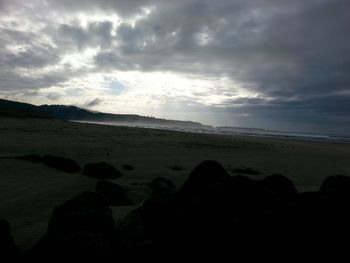 Scenic view of sea against cloudy sky