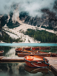 Boats moored in lake