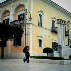 Woman standing in front of building