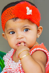 Close-up portrait of cute girl eating food